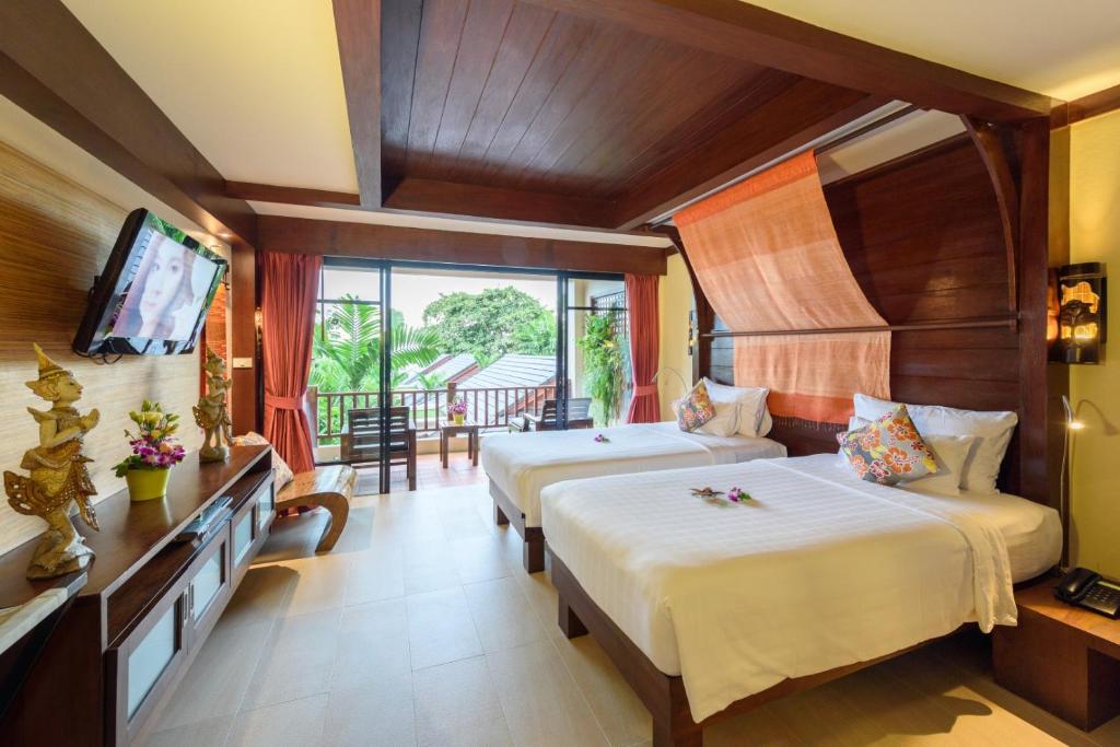 Postel nebo postele na pokoji v ubytování Samui Jasmine Resort - SHA Plus