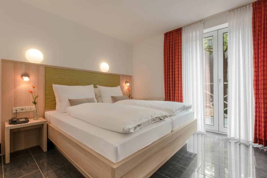 Postel nebo postele na pokoji v ubytování Hotel Europa