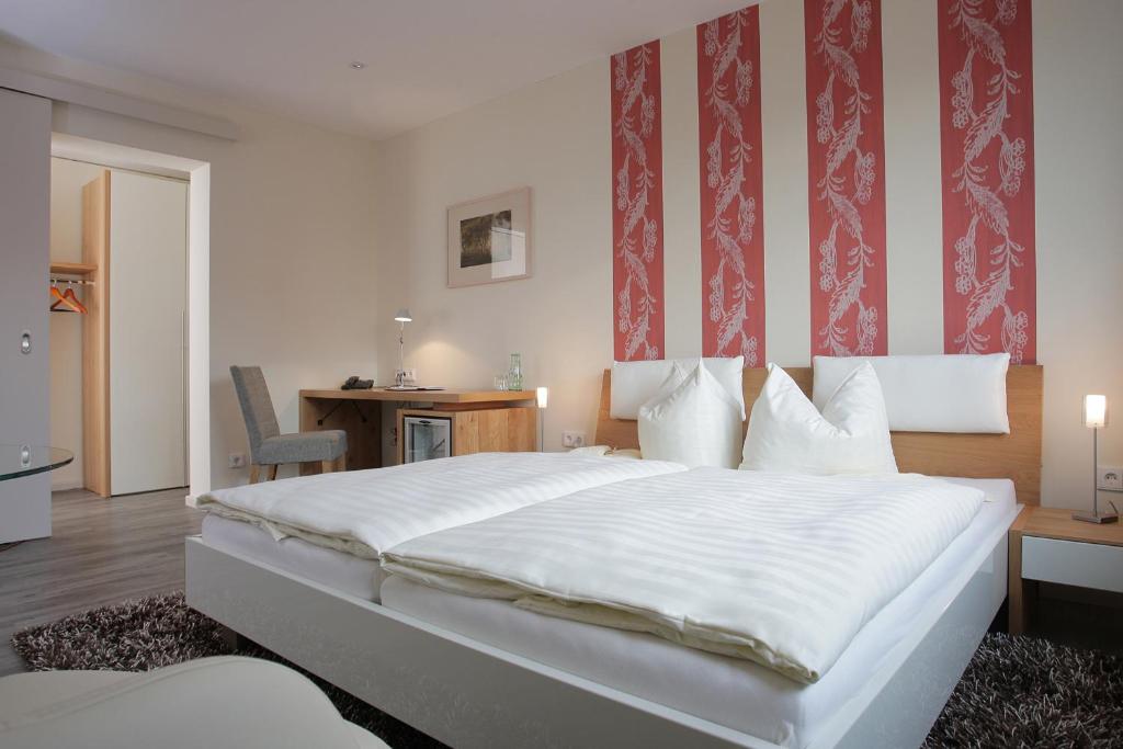 Postel nebo postele na pokoji v ubytování Hotel Rügenblick