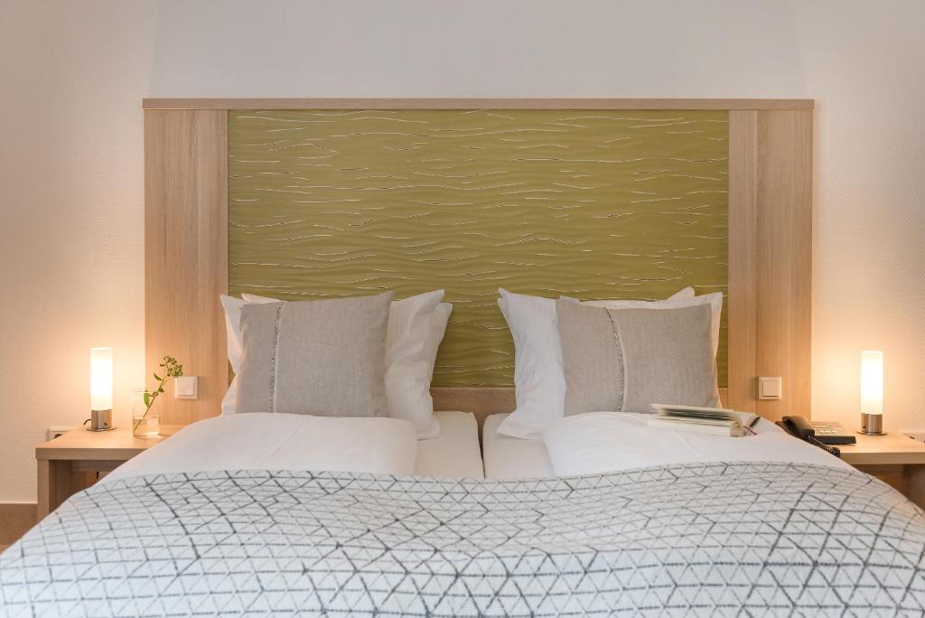 Postel nebo postele na pokoji v ubytování Hotel Europa