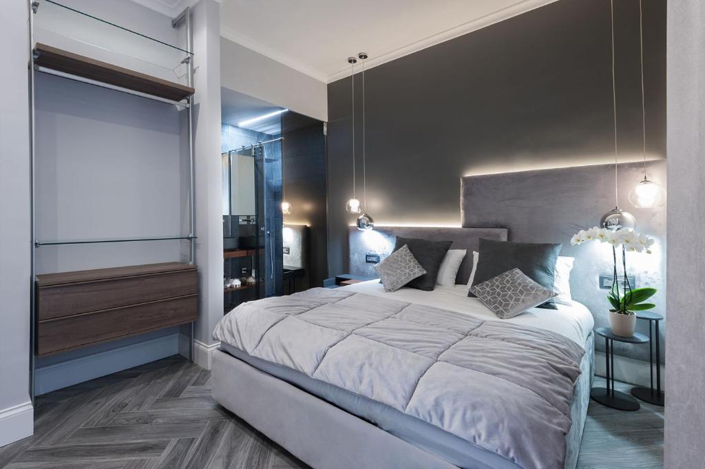a bedroom with a large bed and a large window at LuMa Suite Via Veneto - Your luxury style 22 in Rome