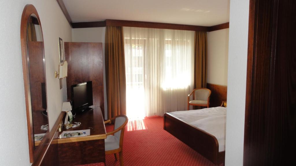Postel nebo postele na pokoji v ubytování Hotel Post Viernheim