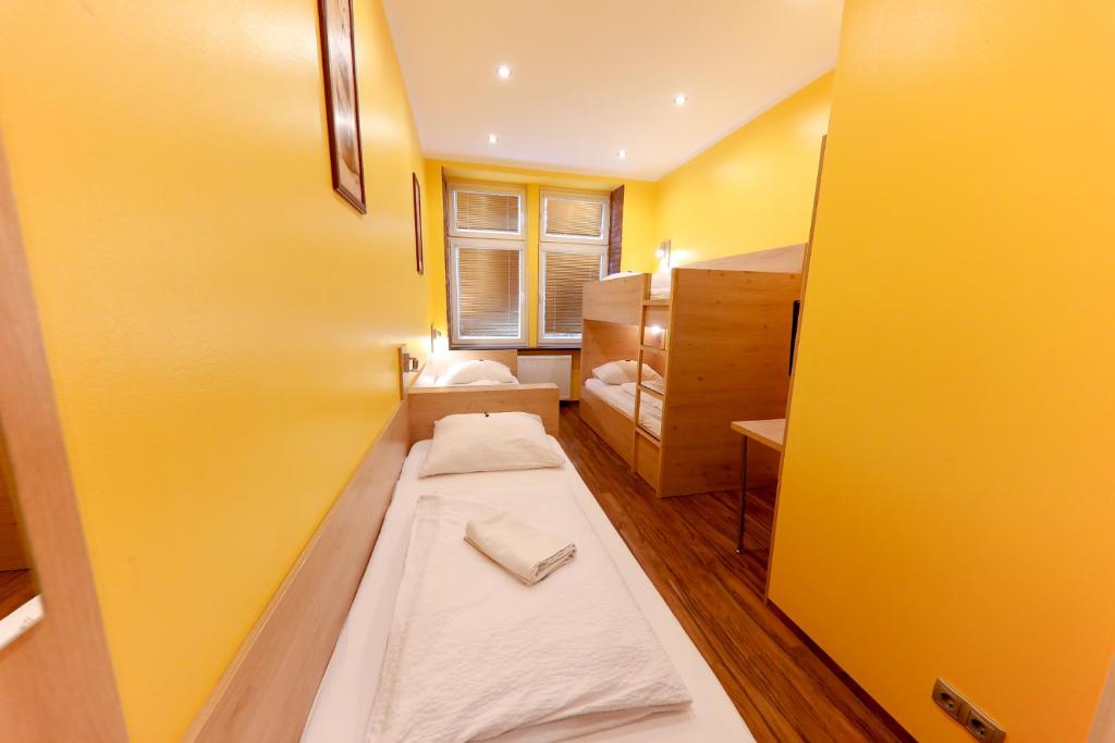 A bed or beds in a room at Do Step Inn Home - Hotel & Hostel