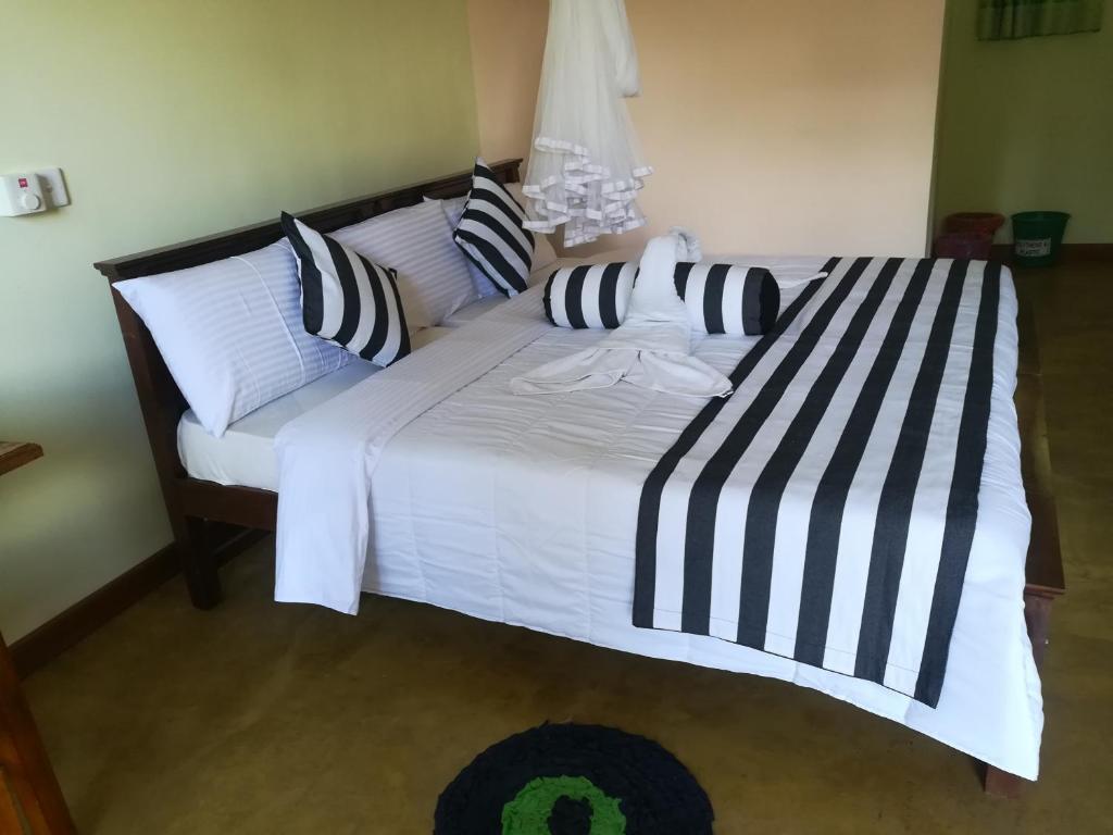 Postel nebo postele na pokoji v ubytování Dinaro Guest