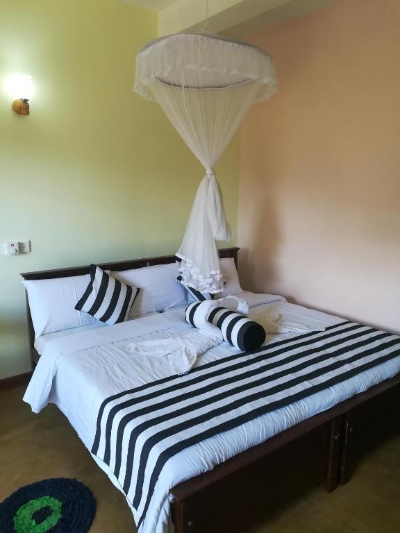 Postel nebo postele na pokoji v ubytování Dinaro Guest