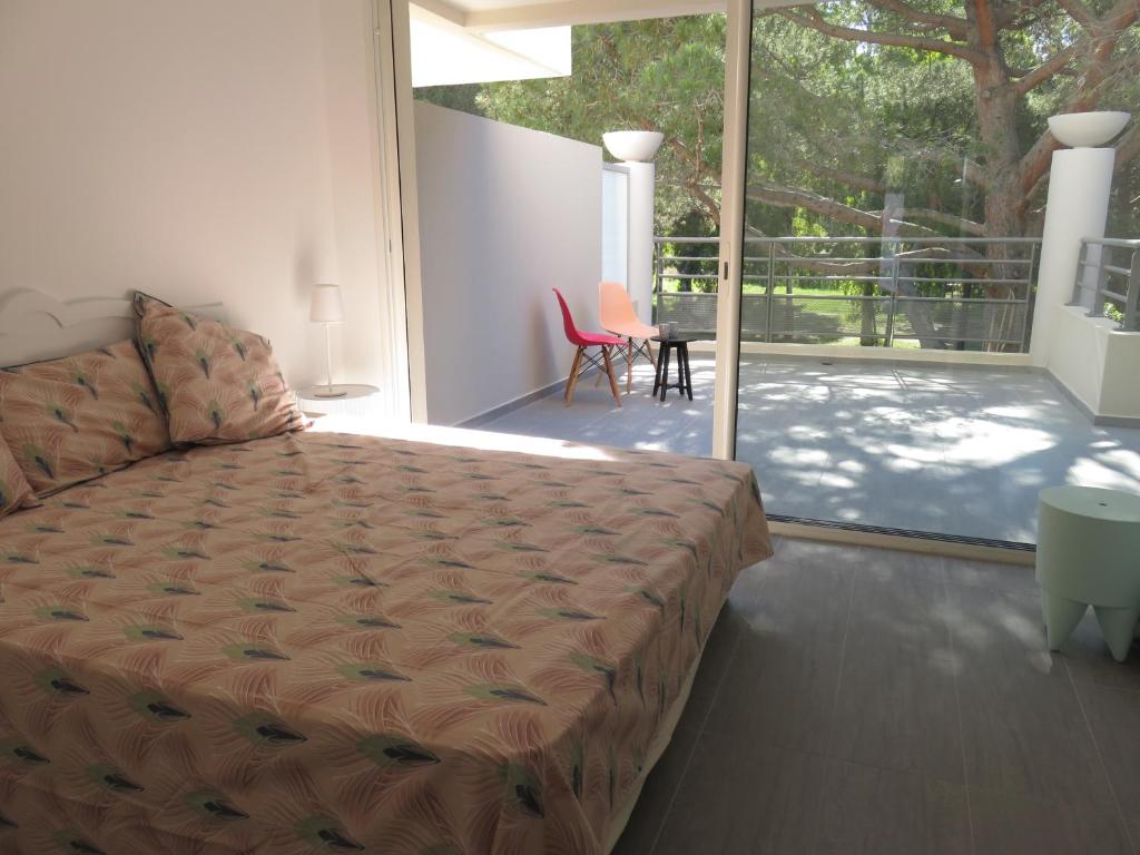 Postel nebo postele na pokoji v ubytování les rivages de calvi