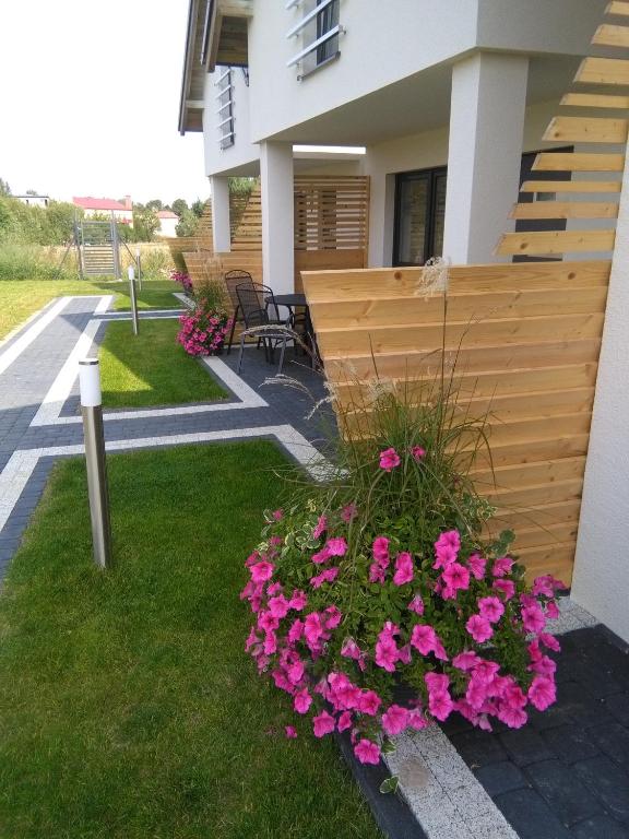 Zahrada ubytování Domki Ancora - komfortowe domki nad morzem