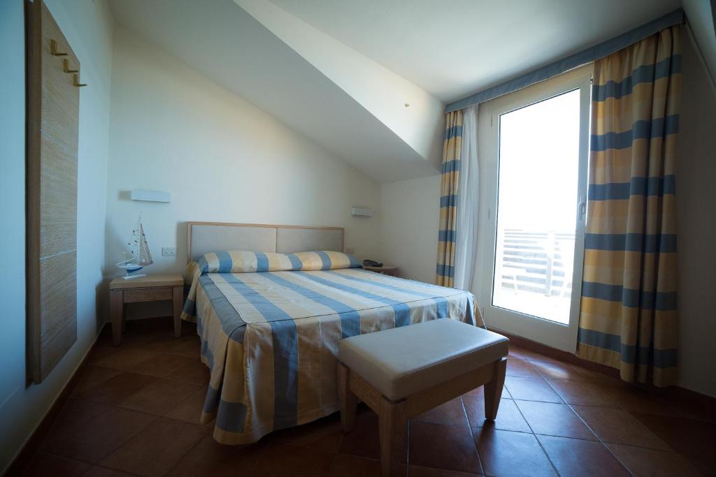Postel nebo postele na pokoji v ubytování Hotel Miramare