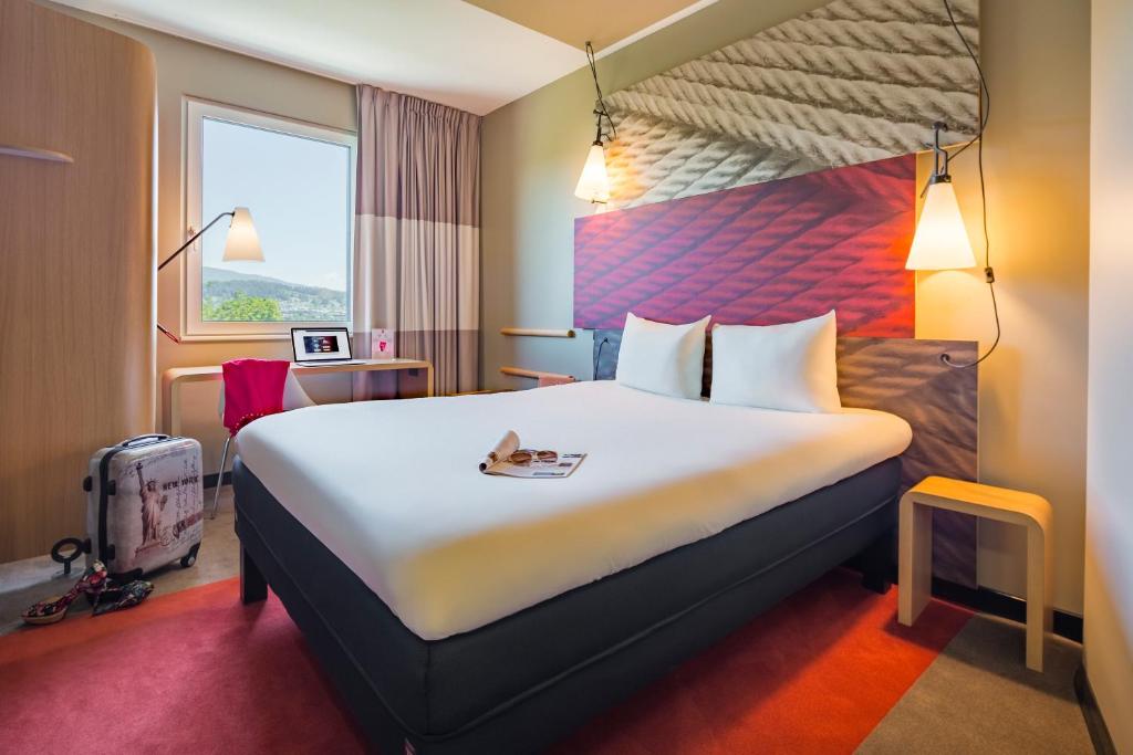 Postel nebo postele na pokoji v ubytování ibis Baden Neuenhof
