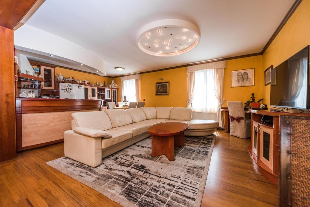 a living room with a couch and a table at Apartment Keti in Novalja