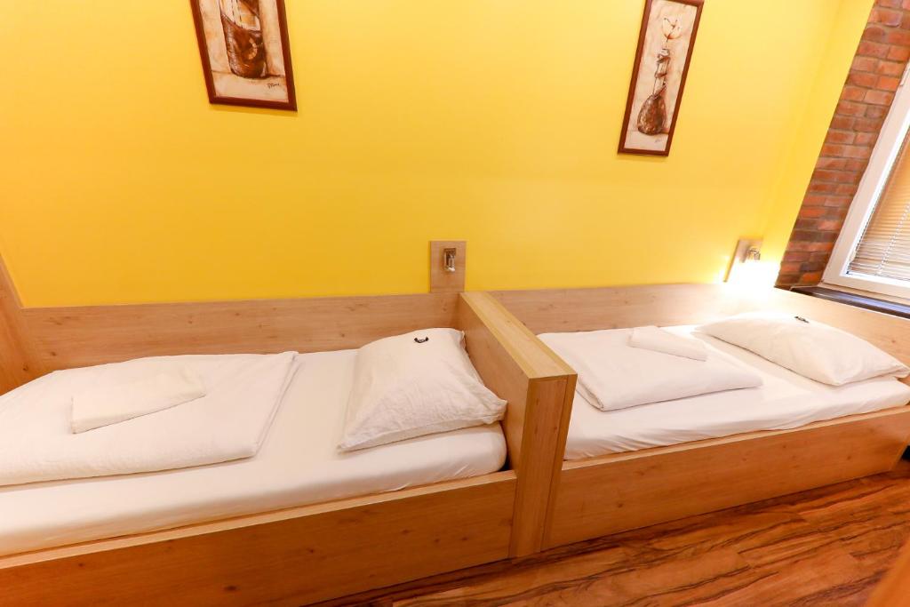 A bed or beds in a room at Do Step Inn Home - Hotel & Hostel