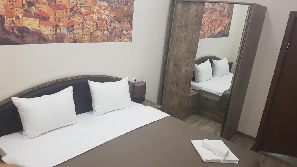 Postel nebo postele na pokoji v ubytování Sweet Rooms Inn