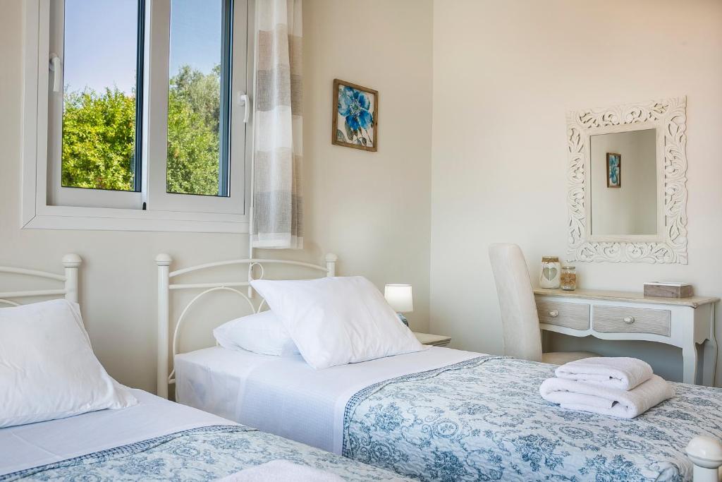 Postel nebo postele na pokoji v ubytování Villa SeaBreeze