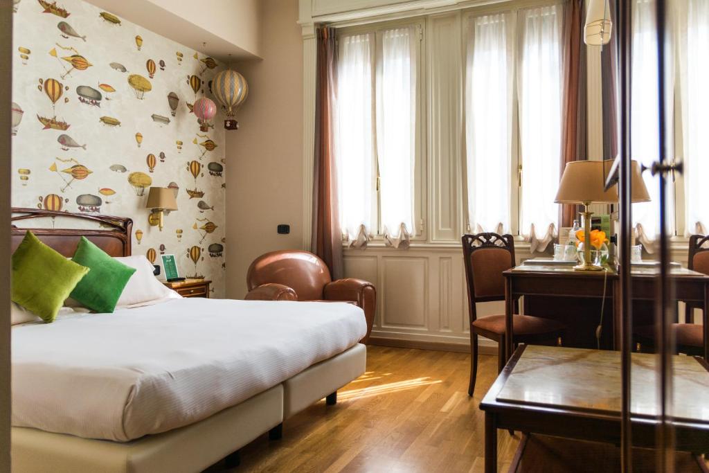 Postel nebo postele na pokoji v ubytování Hotel Continental Genova