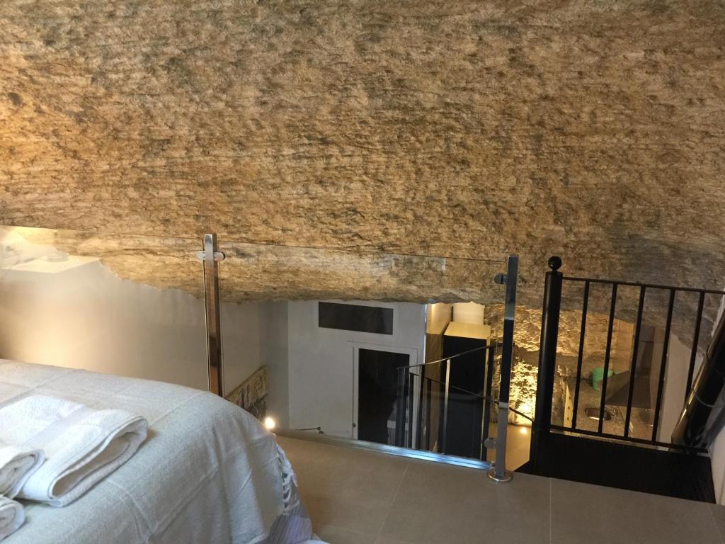 Postel nebo postele na pokoji v ubytování Casa Cueva Un Rincón en la Roca