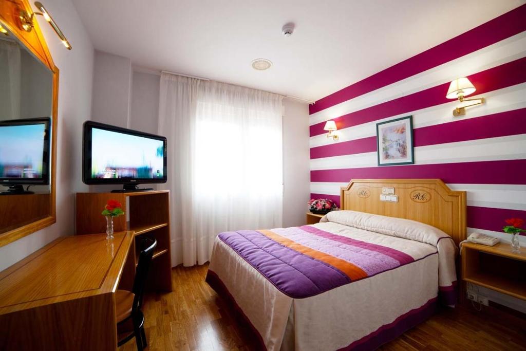 Cama o camas de una habitación en Hotel Río Cabia