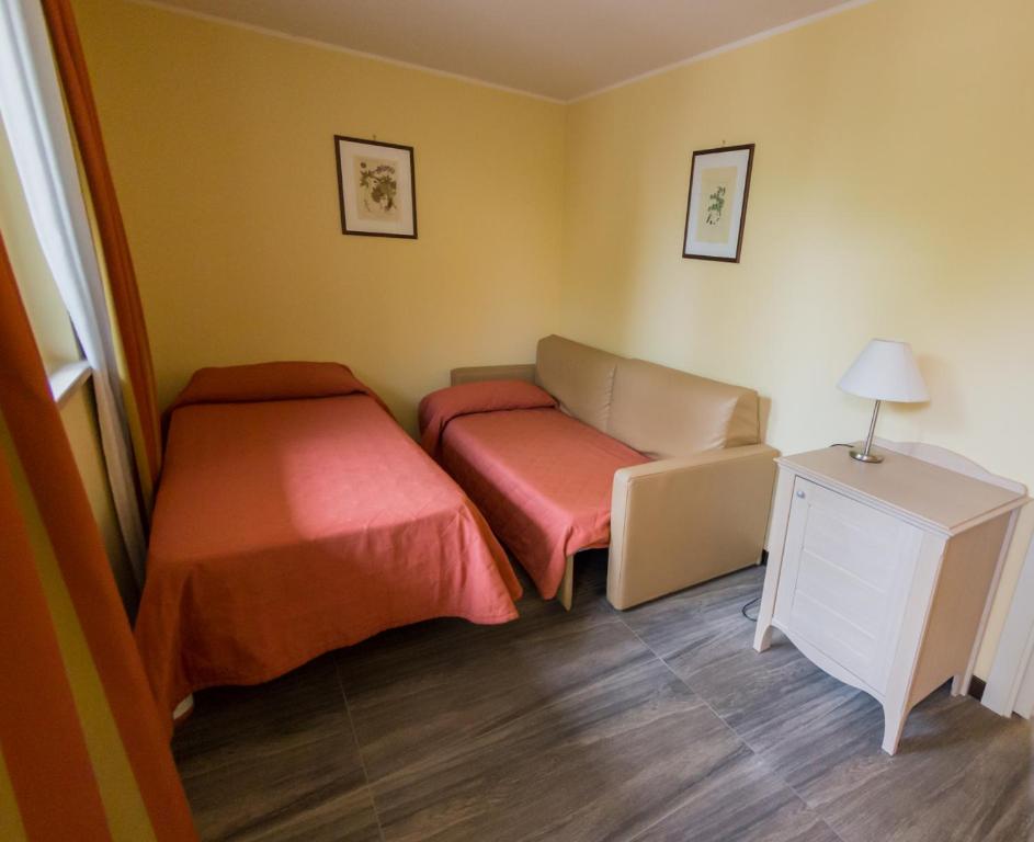Postel nebo postele na pokoji v ubytování Il Parco Sul Mare Resort & SPA