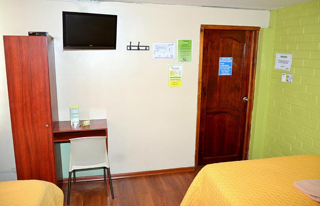 TV a/nebo společenská místnost v ubytování Hostal Terra 4 - EL LABRADOR