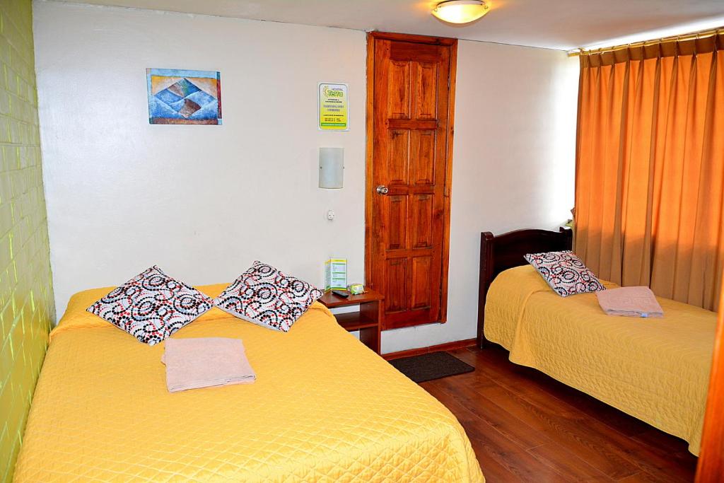 Postel nebo postele na pokoji v ubytování Hostal Terra 4 - EL LABRADOR