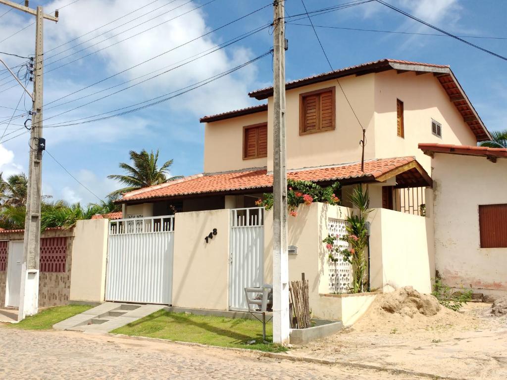 a house on the side of a street at Casa Guajiru in Guajiru