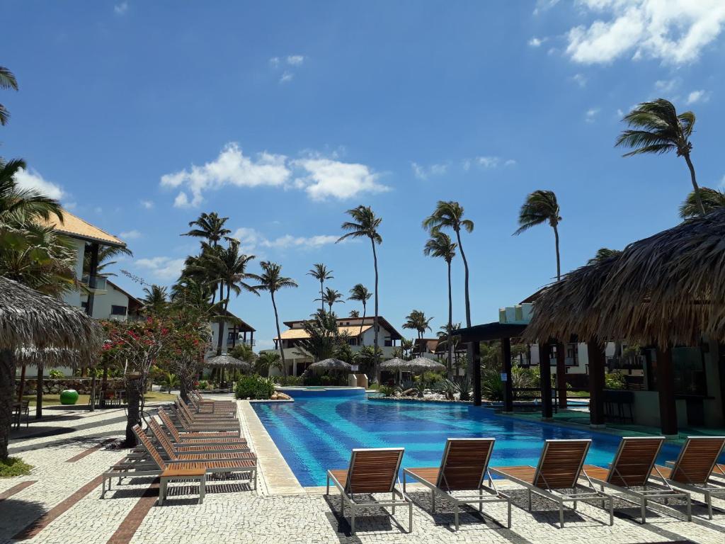בריכת השחייה שנמצאת ב-Apartamento Taíba Beach Resort או באזור