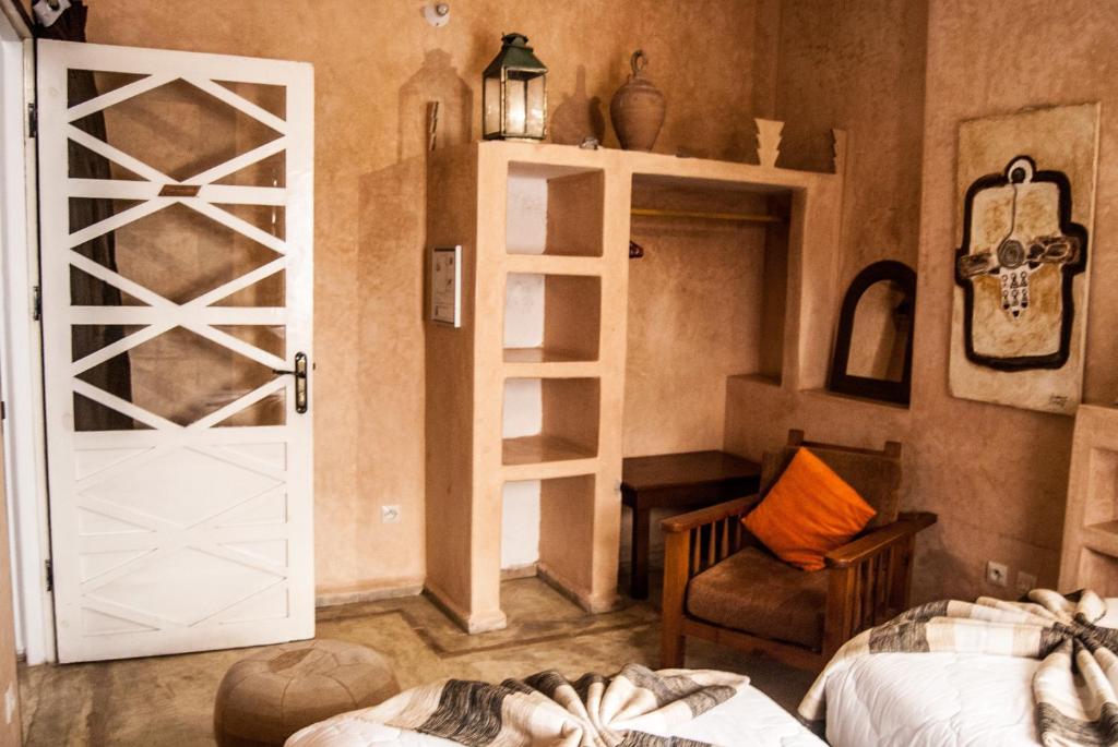 Postel nebo postele na pokoji v ubytování Riad Dar Latigeo