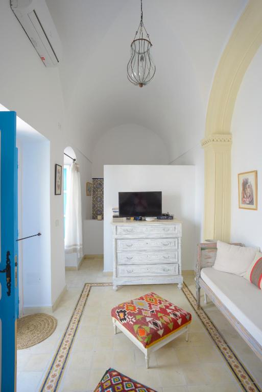 Een bed of bedden in een kamer bij Dar R'Bat, Maison d'Hôtes de charme