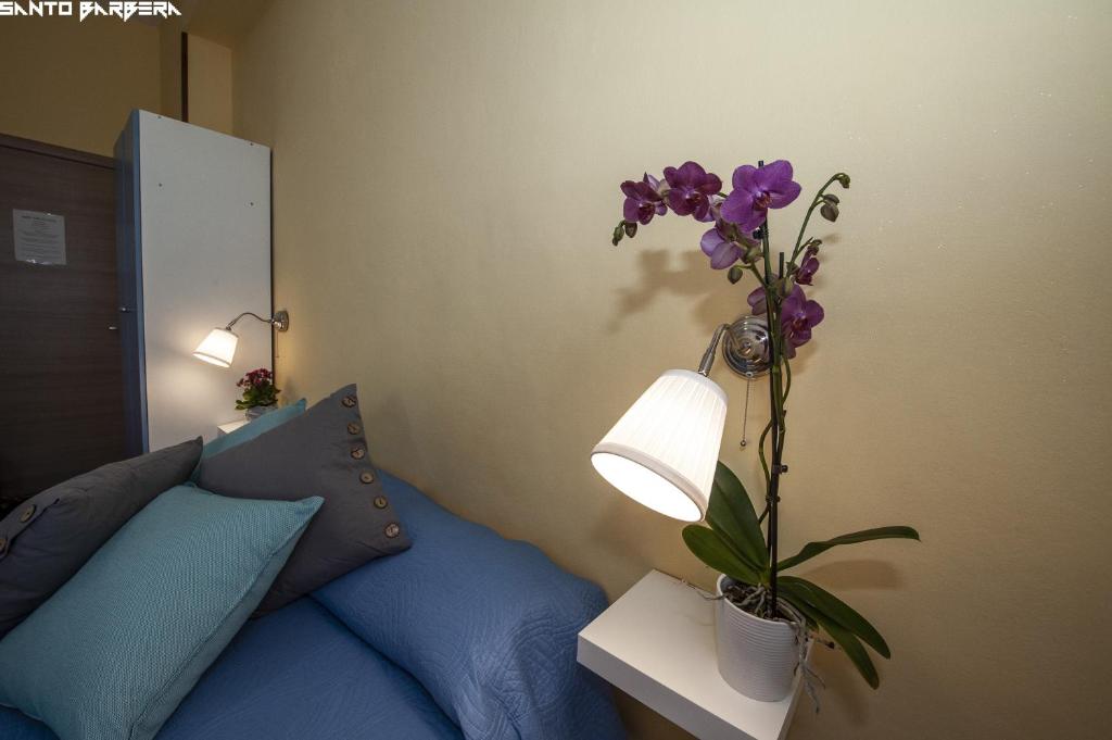 Una cama o camas en una habitación de B&B Villa Eleonora