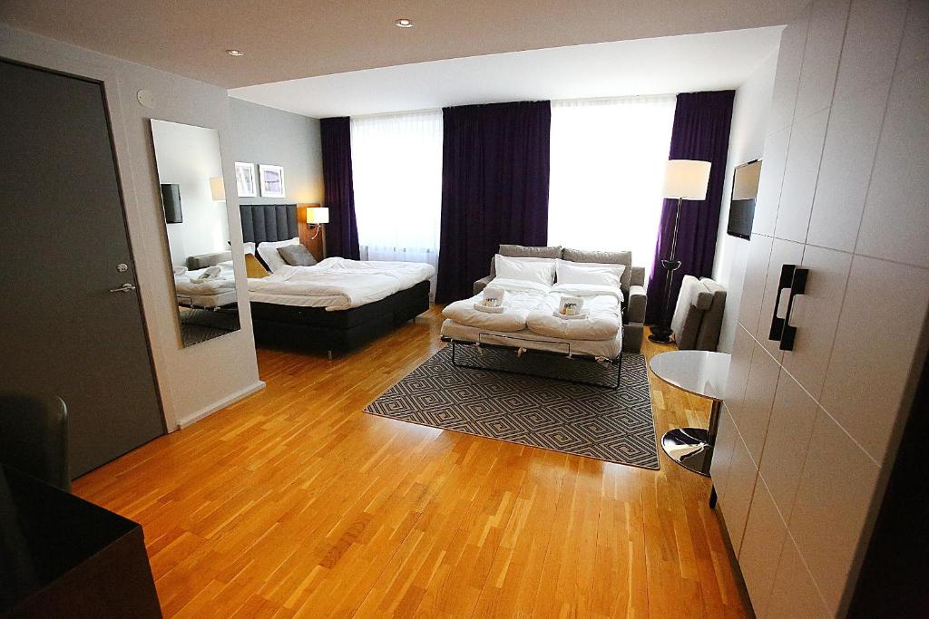 Postel nebo postele na pokoji v ubytování Elite Stadshotellet Eskilstuna