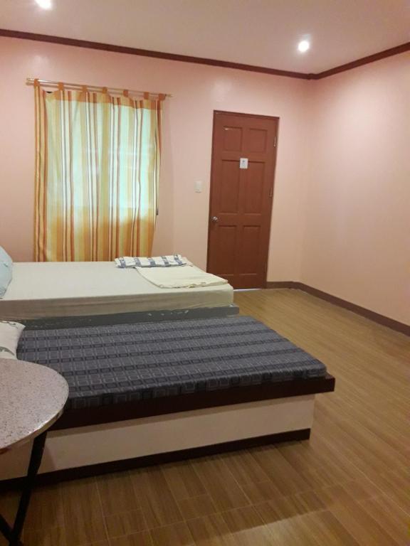 Postel nebo postele na pokoji v ubytování cubby's guesthouse