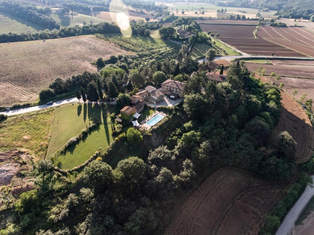 an aerial view of a house on a hill with trees at Casa Vacanze Villa Maria in Anghiari