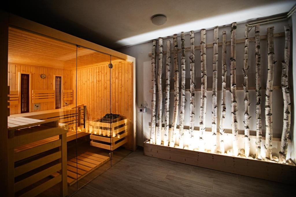 a room with a dressing room with hockey equipment at Chalet Ana Bohinj in Bohinj