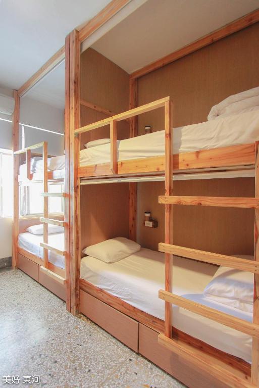 Postel nebo postele na pokoji v ubytování Mayhow Donghe