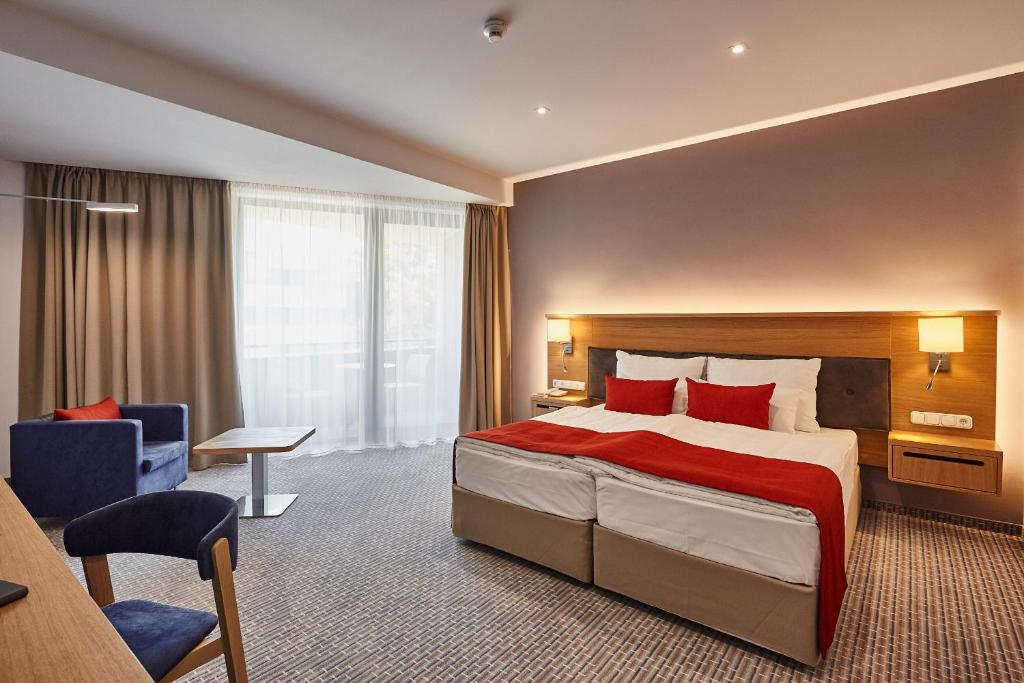 Postel nebo postele na pokoji v ubytování Thermal Hotel Balance Lenti