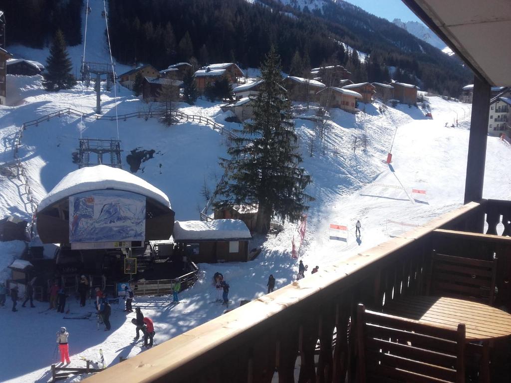 a group of people on a ski lift in the snow at Le Thabor in Valfréjus