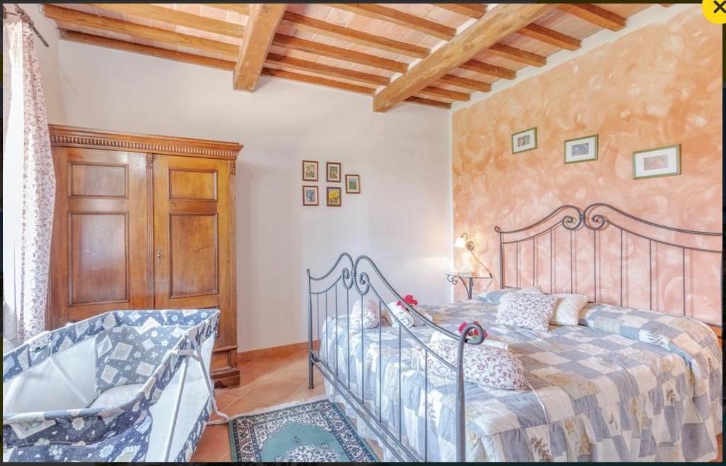 Postel nebo postele na pokoji v ubytování Bio Agriturismo Il Cavone