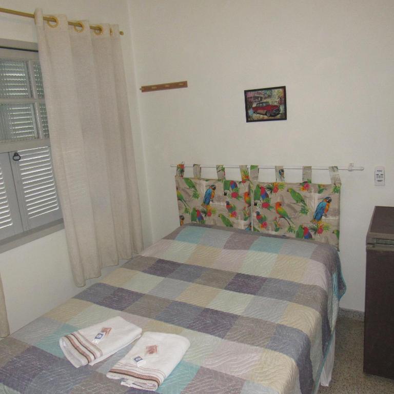 Postel nebo postele na pokoji v ubytování Hotel Pousada Girassol