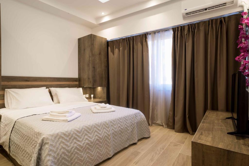 Posteľ alebo postele v izbe v ubytovaní Electra & Myrto Apartments