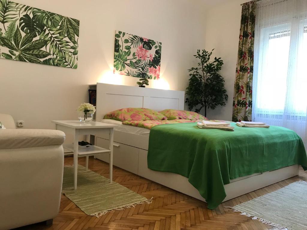 Posteľ alebo postele v izbe v ubytovaní Rosmarinus Apartman