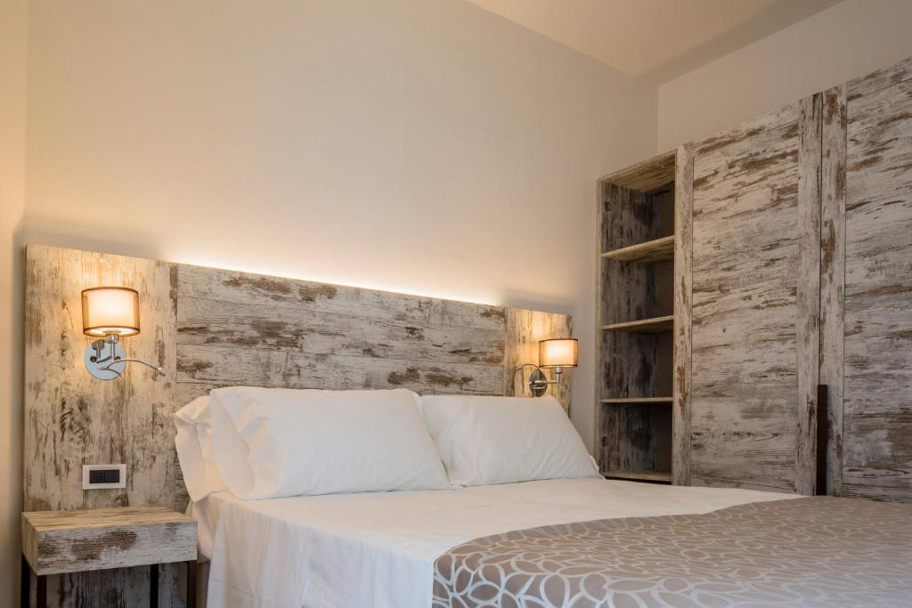 Postel nebo postele na pokoji v ubytování Hotel Ambassador