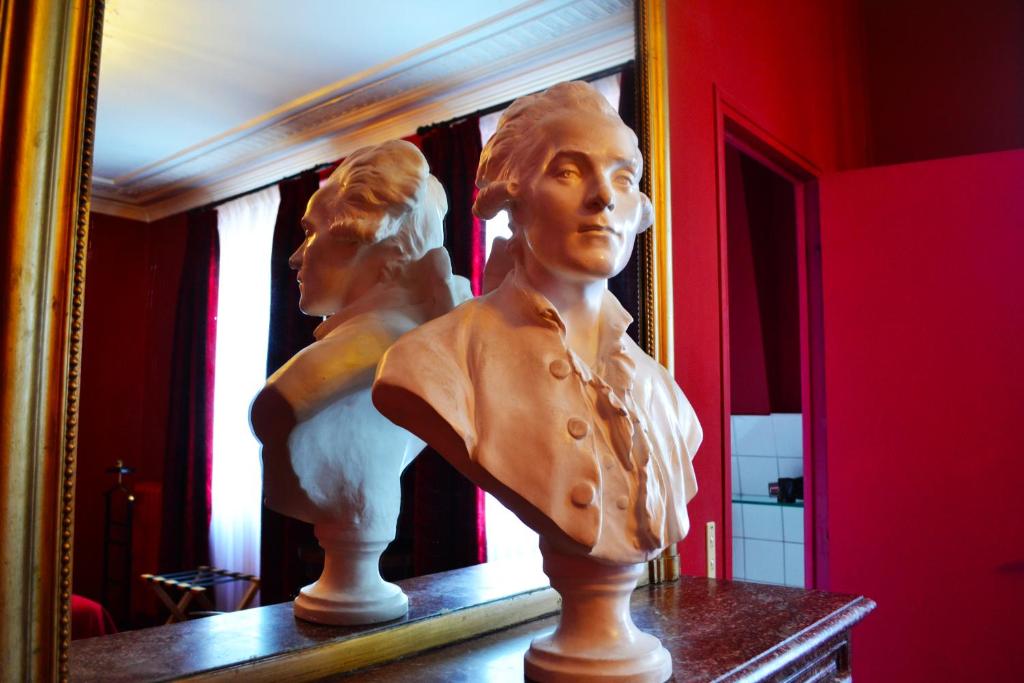 a statue of a bust of a woman on a table at Hotel Windsor Home in Paris