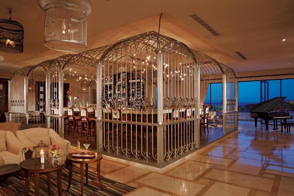 Posezení v ubytování Secrets Puerto Los Cabos Golf & Spa18+