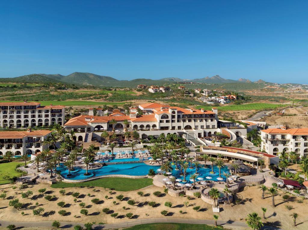 a large building with a lot of trees at Secrets Puerto Los Cabos Golf & Spa18+ in San José del Cabo