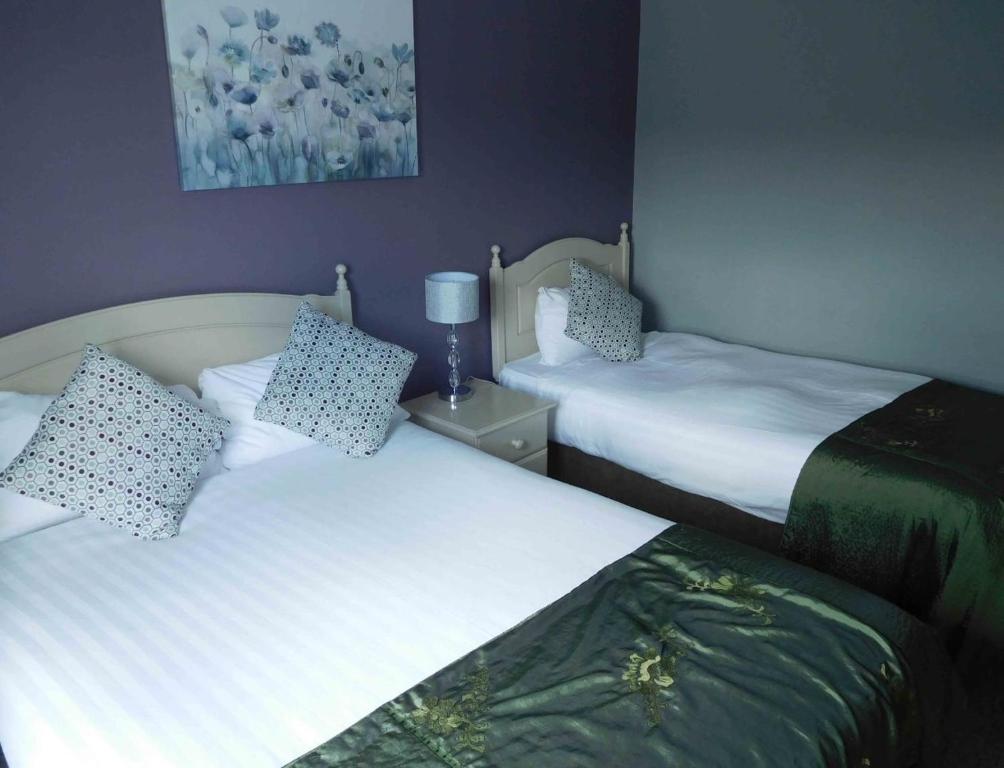 Postel nebo postele na pokoji v ubytování Anam Cara B&B