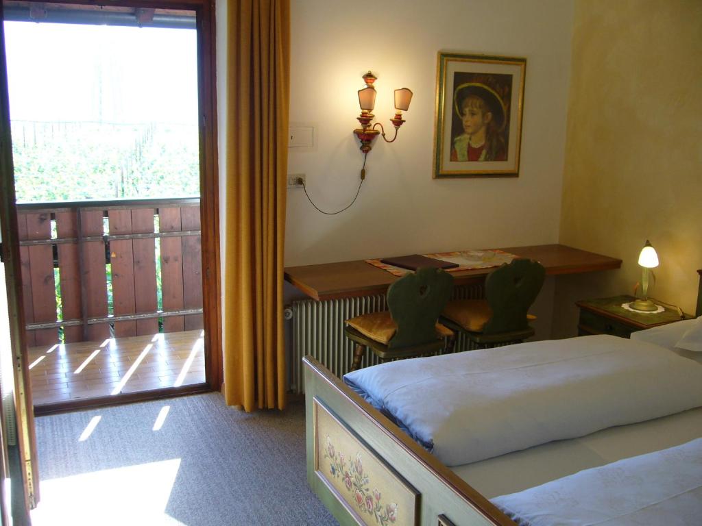 Postel nebo postele na pokoji v ubytování Hotel Gasthof WASTL