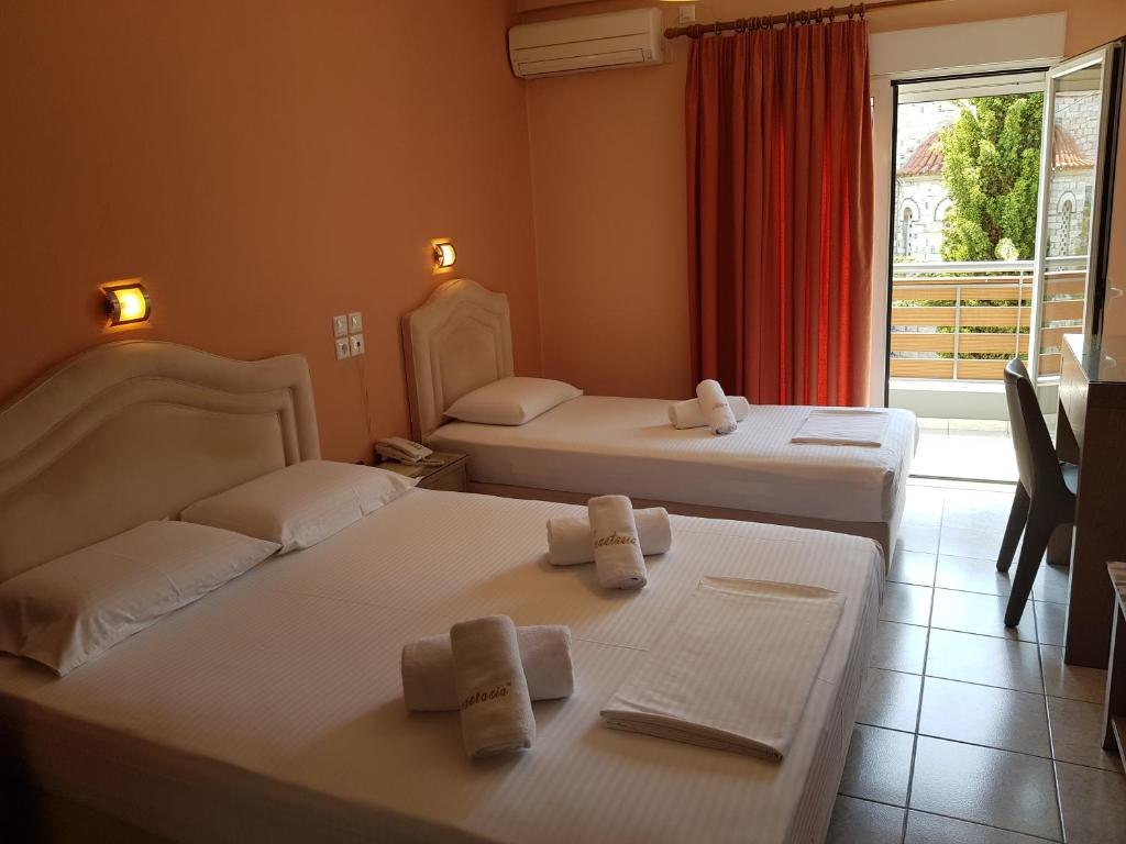Ένα ή περισσότερα κρεβάτια σε δωμάτιο στο Ξενοδοχείο Αναστασία