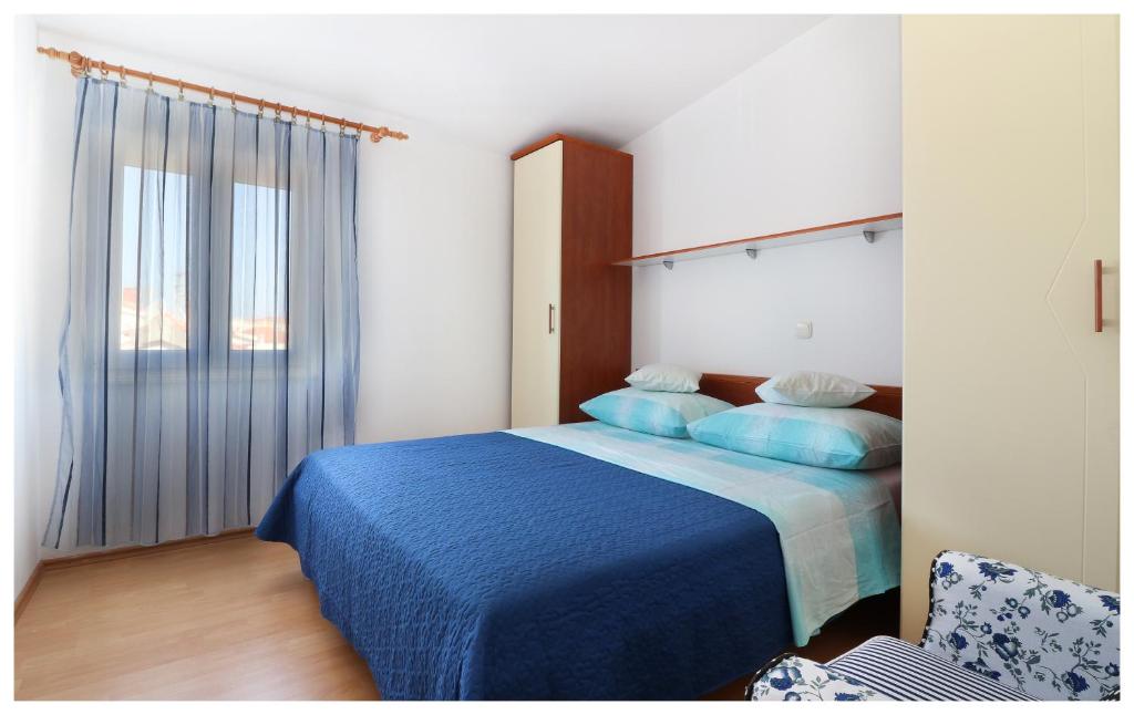 Postel nebo postele na pokoji v ubytování Apartmani Petra