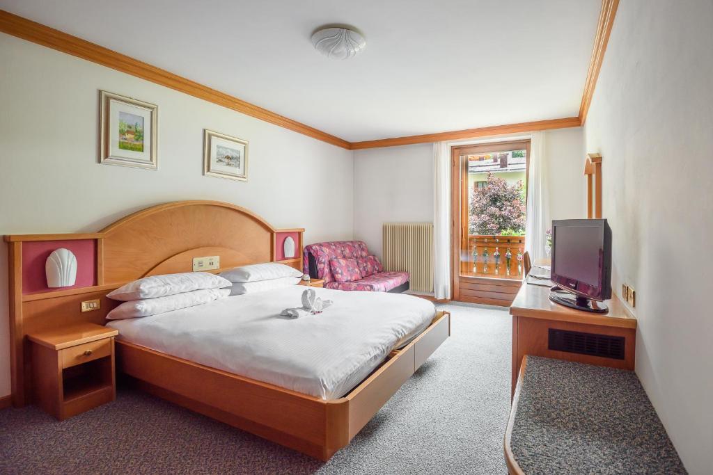 Postel nebo postele na pokoji v ubytování Hotel St. Raphael