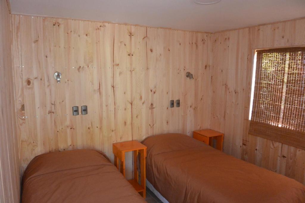 Postel nebo postele na pokoji v ubytování Lodge Colbún