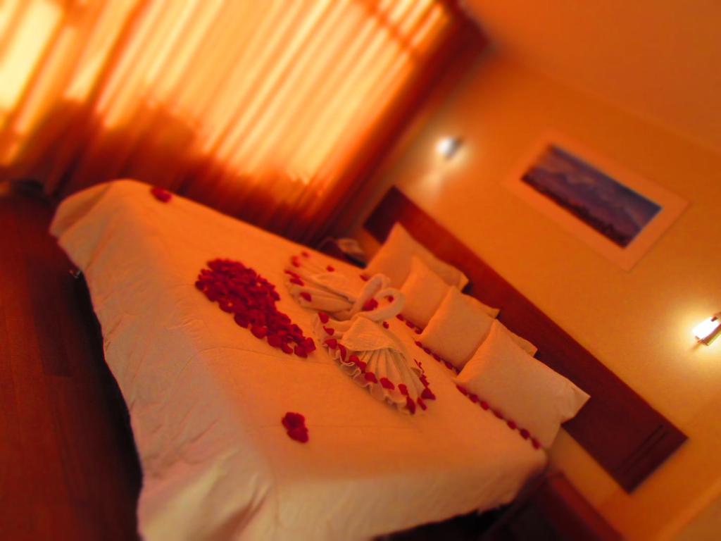 Postel nebo postele na pokoji v ubytování Hostal Qoyllurwasi
